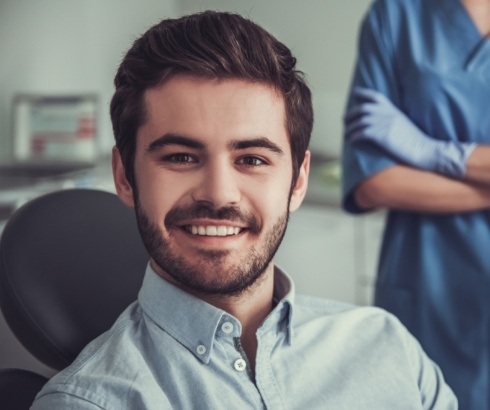 Young man smiling in dental chair