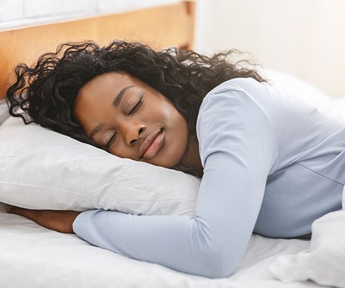 Woman sleeping peacefully after QuietNite laser therapy
