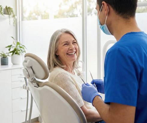 Dentist and patient talking during consultation