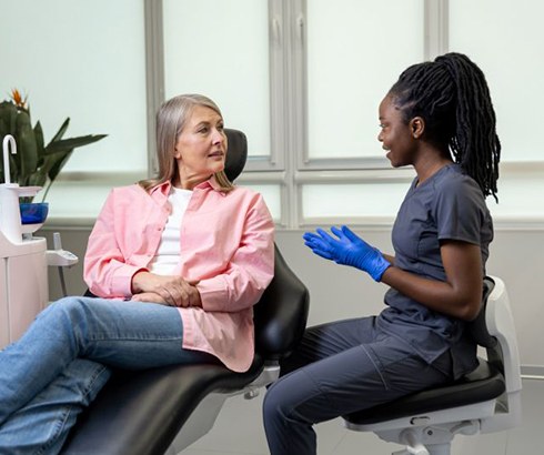 Patient and dental team member talking during consultation