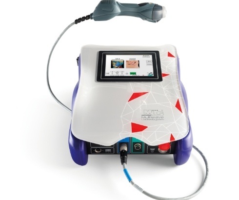 Dental laser attached via cord to small box shaped machine
