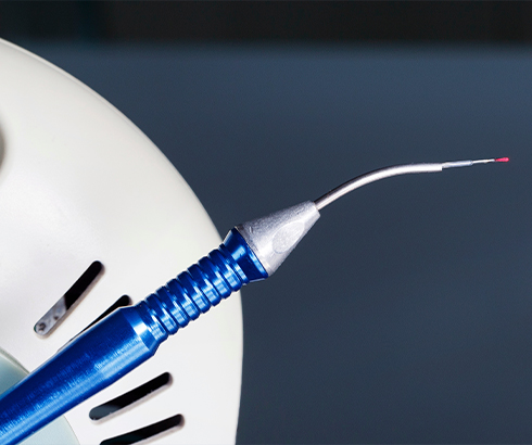 Dental laser attached to thin blue pen like device