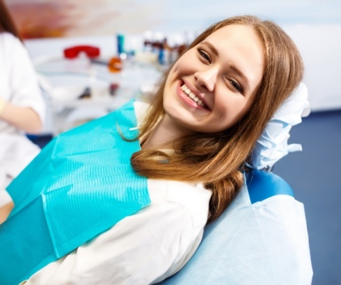 Young woman smiling in dental chair