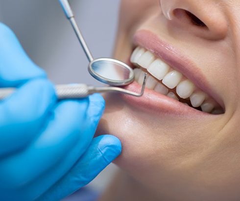 a person undergoing equilibration/occlusal adjustments