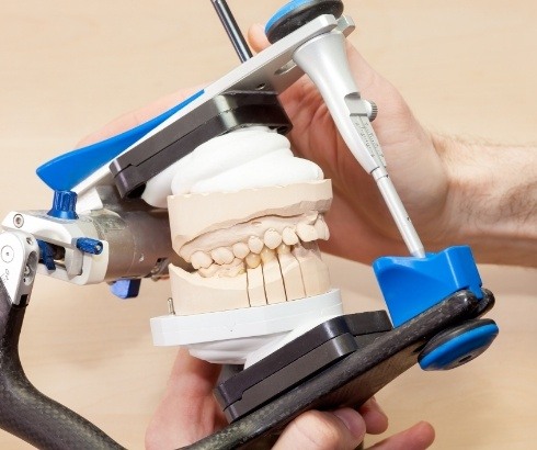 Dentist designing a dental restoration