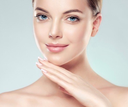 Woman with eyes closed receiving Botox injection