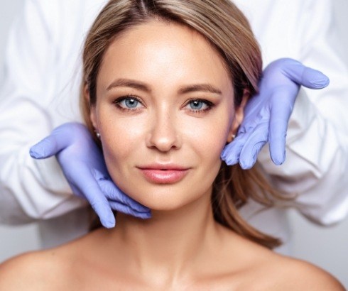 Dentist injecting a patient with Botox in their jaw for T M J treatment