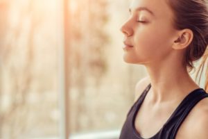 Healthy woman breathing through her nose