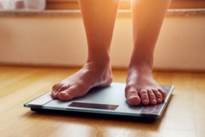 Person standing on weight scale