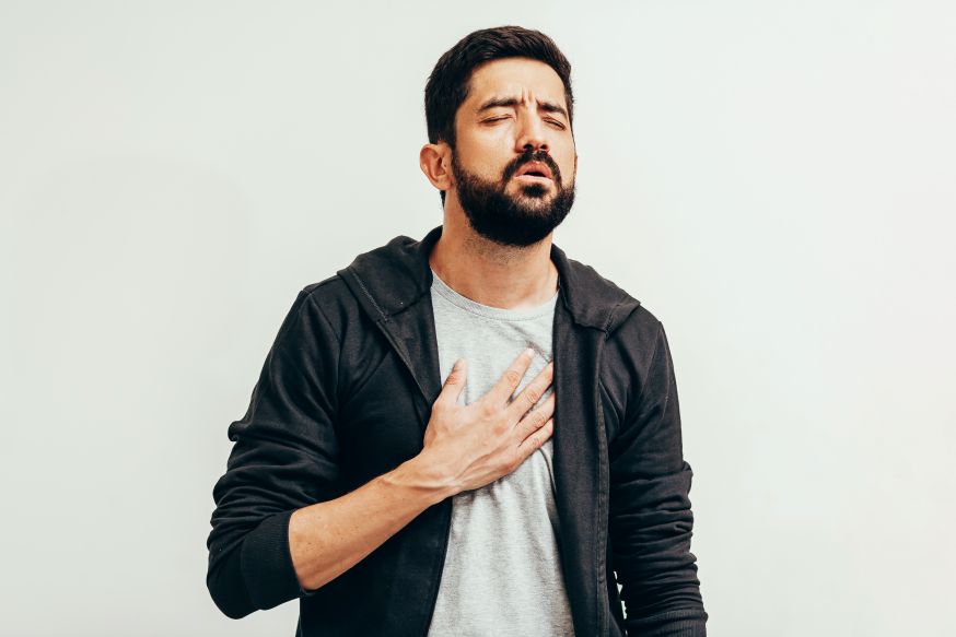 A man struggling to catch his breath