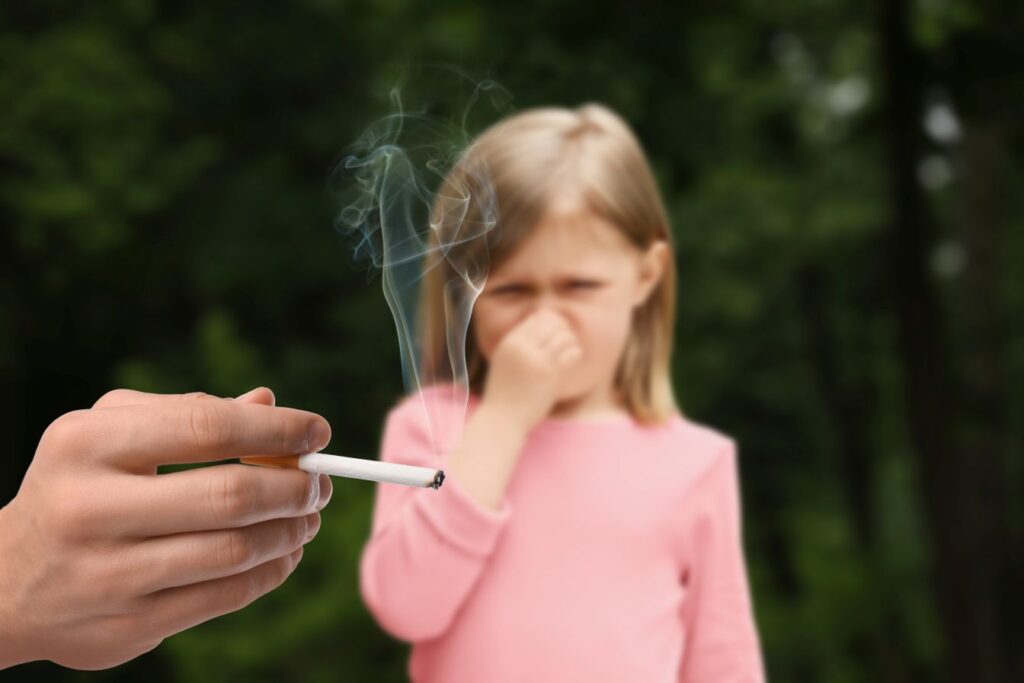A child trying to avoid secondhand smoke